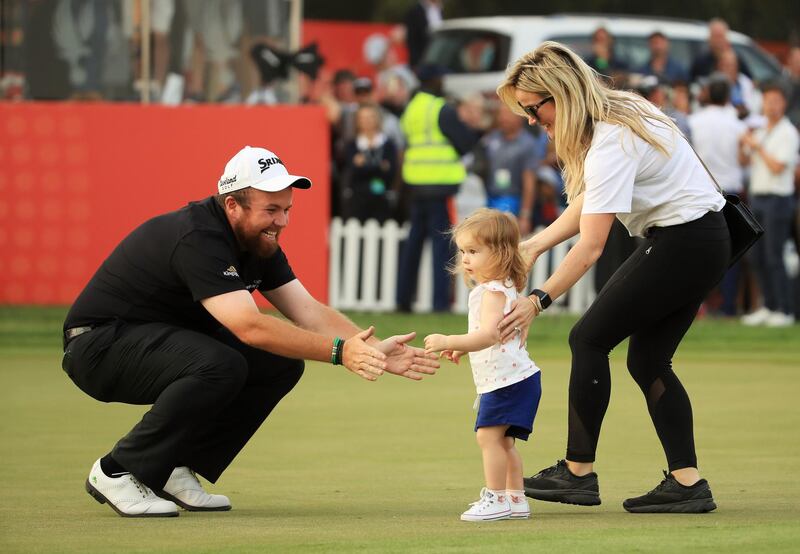 Lowry celebrates with wife Wendy Honner and daughter Iris.