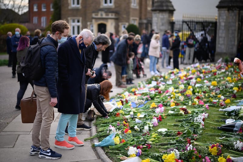 Actor Sir Ian McKellen looks at floral tributes outside Windsor Castle, in Windsor, England. Getty Images