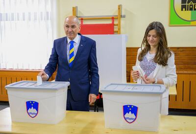 Slovenia's Prime Minister and President Janez Jansa and his wife Urska cast their ballots during the general election on April 24. AFP