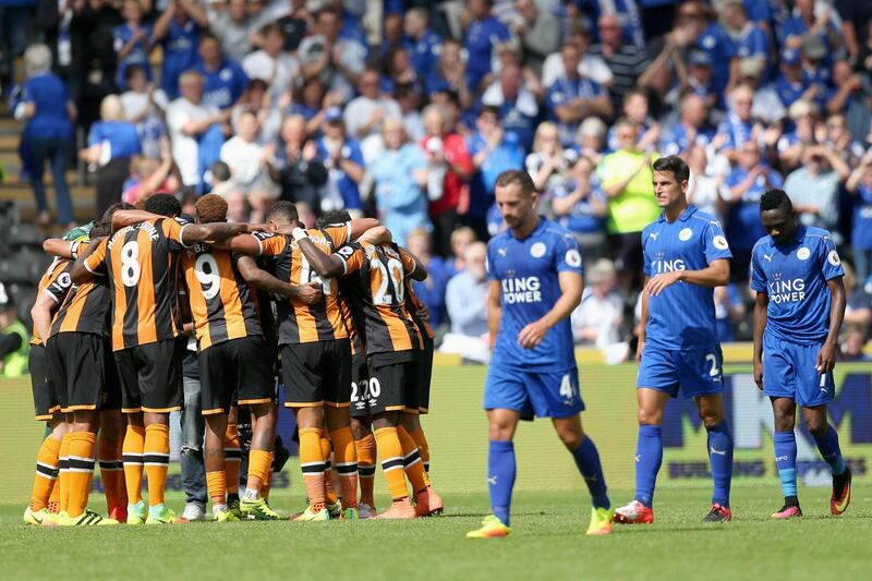HULL, ENGLAND - AUGUST 13: Hull City players create a huddle after the final whistle while the Leicester City players show dejection during the Premier League match between Hull City and Leicester City at KCOM Stadium on August 13, 2016 in Hull, England.  (Photo by Alex Morton/Getty Images)