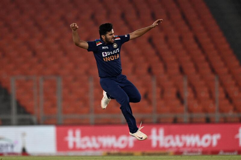 India's Shardul Thakur celebrates after taking the wicket of Dawid Malan. AFP
