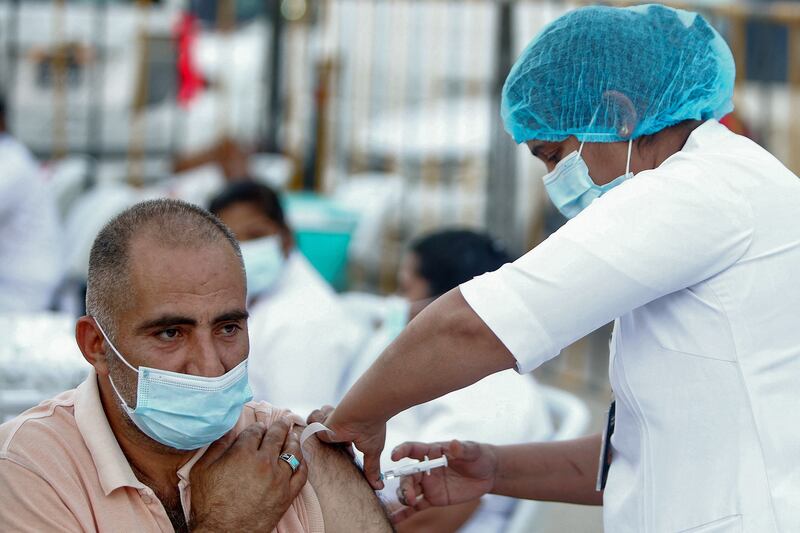 A man receives his Covid-19 vaccine during a mass vaccination campaign in the Bneid Al Gar district of Kuwait. All photos: Yasser Al-Zayyat / AFP