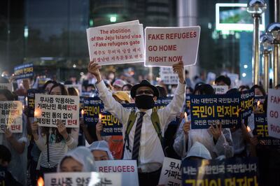 Anti-immigration activists at a protest in Seoul against a refugees from Yemen on June 30, 2018. AFP