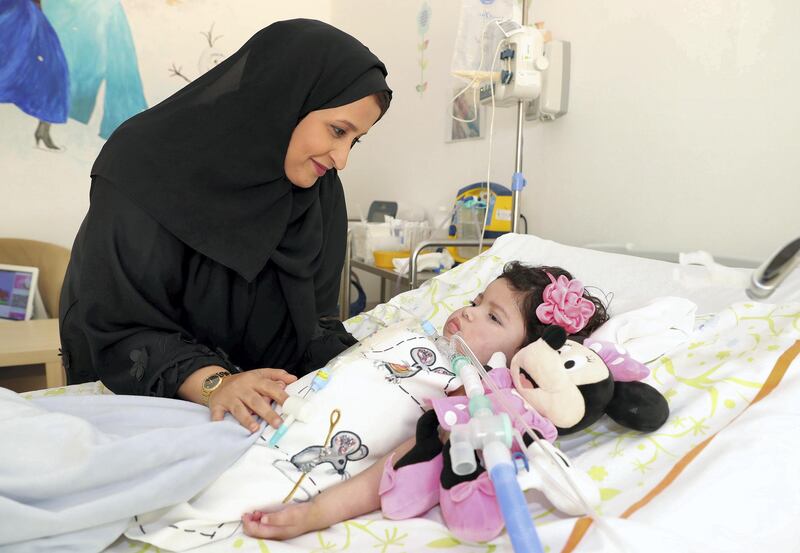 Abu Dhabi, United Arab Emirates - August 17th, 2017: Meera Bin Touq with Ousha Bin Touq, 2, on a story about SMA (Spinal Muscular Atrophy) which is a condition which is highly prevalent in the UAE and growing in numbers in the region and at least 50 times higher than in the US, with over 50 cases per 100,000 live births in GCC populations compared to only 1.2 in the United States. Thursday, August 17th, 2017 in Amana Healthcare, Khalifa City, Abu Dhabi. Chris Whiteoak / The National