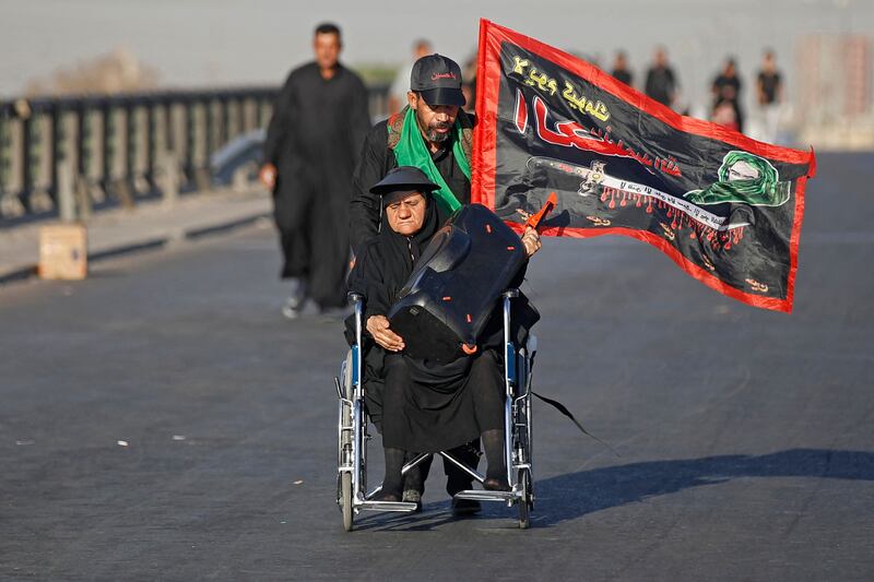 Shiite Muslim pilgrims march from Baghdad towards the shrine city of Karbala.
