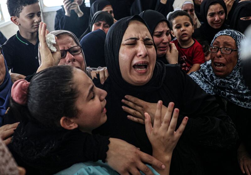 Relatives of Khaled Mansour react to his death. AFP