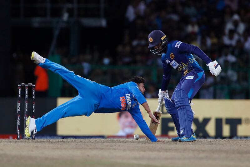 Kuldeep Yadav of India dives to catch a ball during the Asia Cup Super Four match against Sri Lanka. Getty