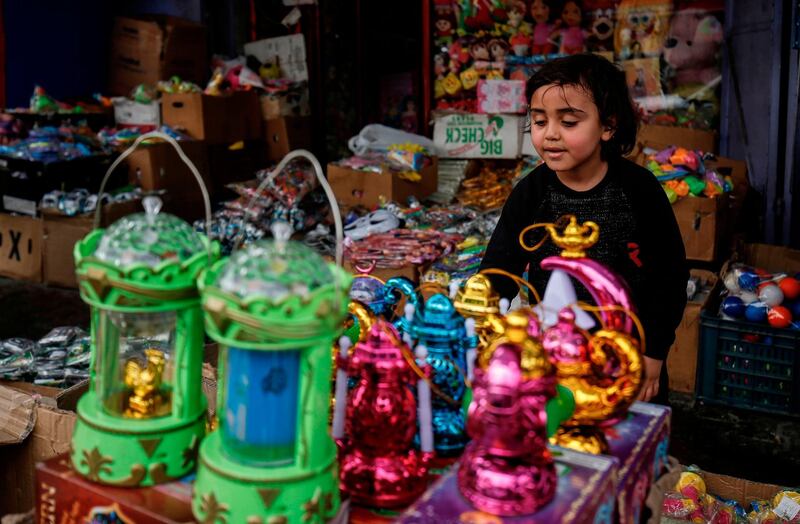 A Palestinian boy picks out a traditional lantern known in Arabic as "Fanous" during the first day of the Muslim holy month of Ramadan, in Rafah in the southern Gaza Strip. AFP