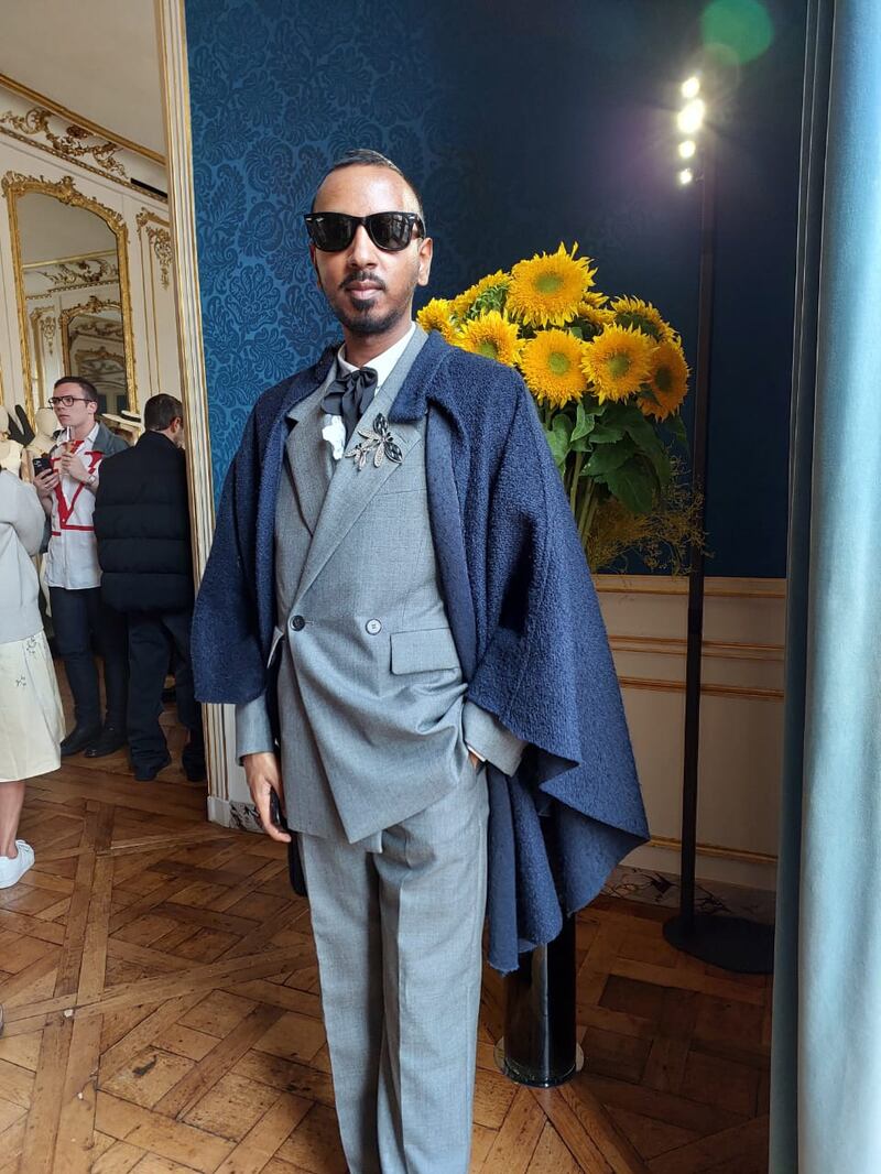 Double breasted suit and a cape, at the Schiaparelli presentation.
