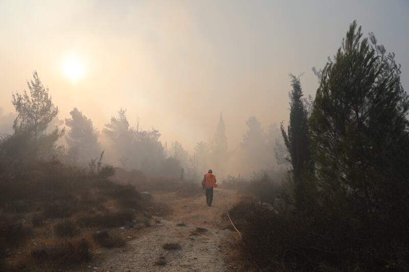 As a huge wildfire spread in Jerusalem, emergency teams evacuated residents.