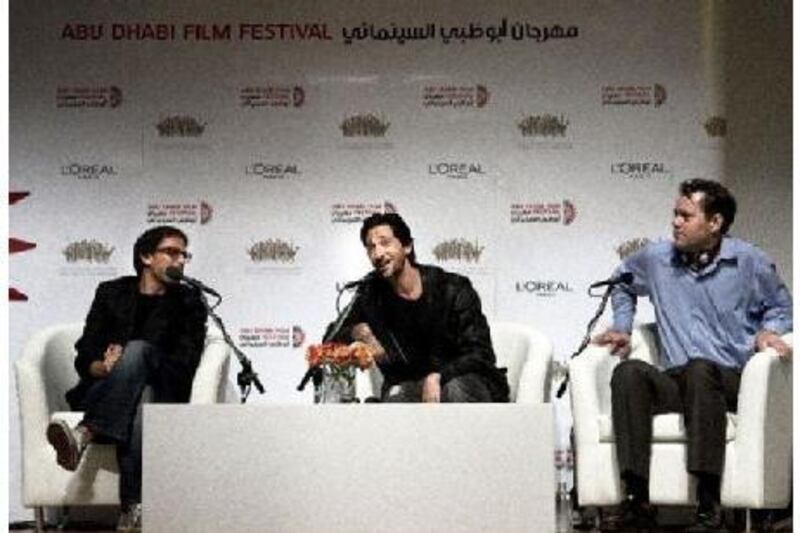From left, the director of Wrecked, Michael Greenspan, the movie's star, Adrien Brody, and the producer Kyle Mann discuss their new film to a thrilled audience at Abu Dhabi Film Festival.