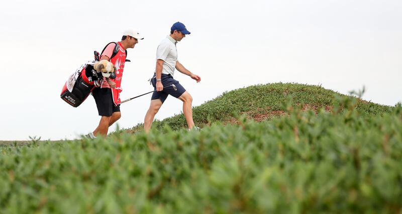 Rory McIlroy with his caddy Harry Diamond on the 17th hole. Getty