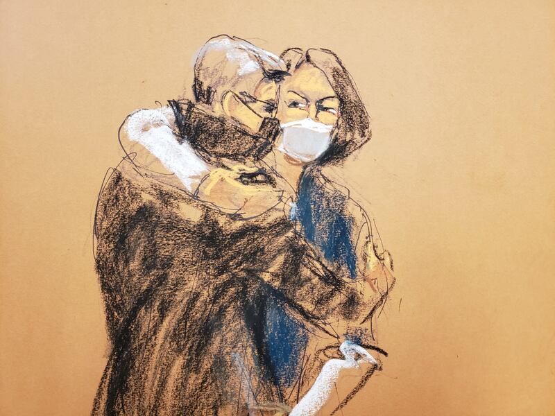 Jeffrey Epstein associate Ghislaine Maxwell hugs her attorney as they enter the courtroom for the questioning of juror number 50 by Judge Alison Nathan in a courtroom sketch in New York City, on March 8, 2022. Reuters