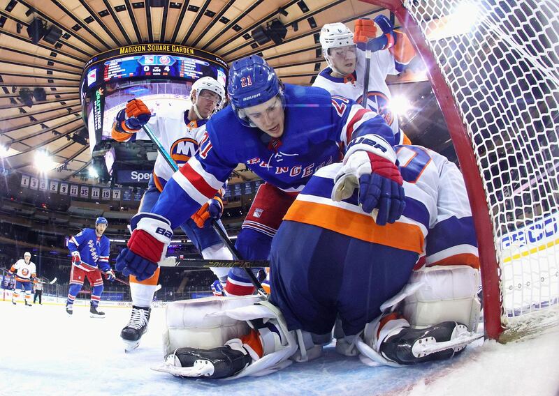 Brett Howden, of the New York Rangers, tumbles over New York Islanders' Semyon Varlamov at Madison Square Garden on Thursday, April 29. The Islanders won the NHL match 4-0. Reuters