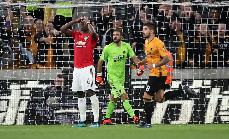 Pogba reacts to his spot-kick miss. AP Photo