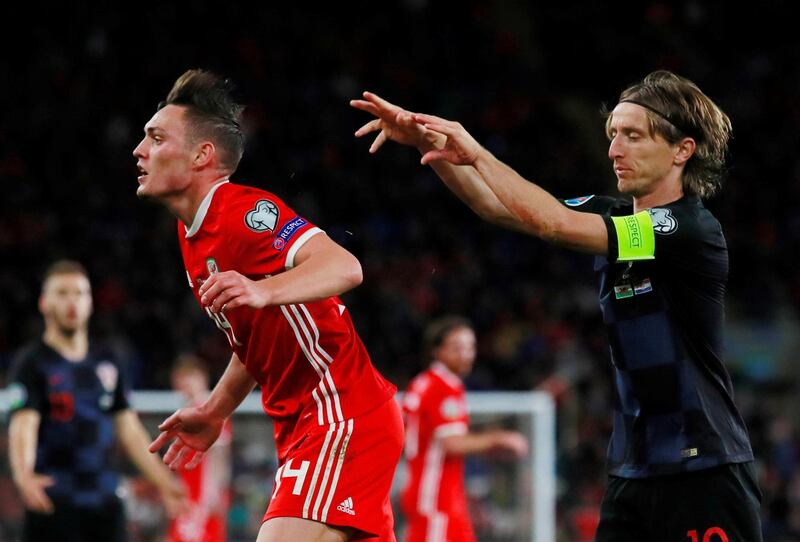 Wales' Connor Roberts and Croatia's Luka Modric clash. Reuters