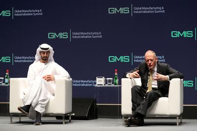 Omar Al Olama and Lord Gerry Grimstone speaking at the Global Manufacturing and Industrialisation Summit in Dubai on Monday. Pawan Singh / The National
