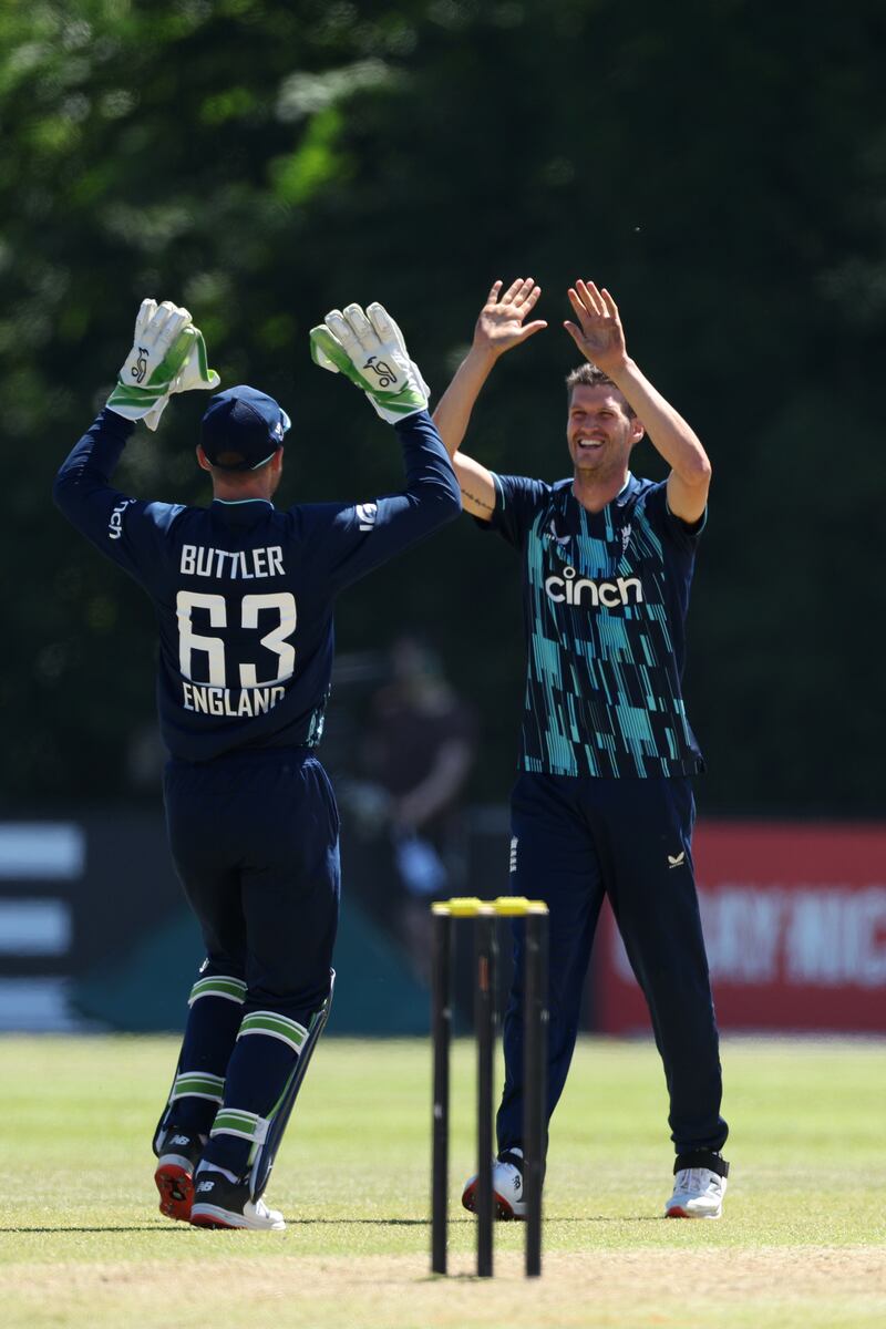 England bowler David Payne celebrates taking the wicket of Scott Edwards. Getty