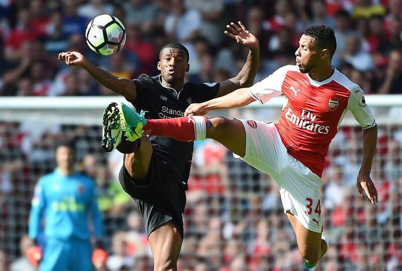 Liverpool’s Georginio Wijnaldum (L) vies for the ball with Arsenal’s Francis Coquelin (R) during the Premier League match between Arsenal and Liverpool at the Emirates Stadium in London, Britain, 14 August 2016. Andy Rain / EPA