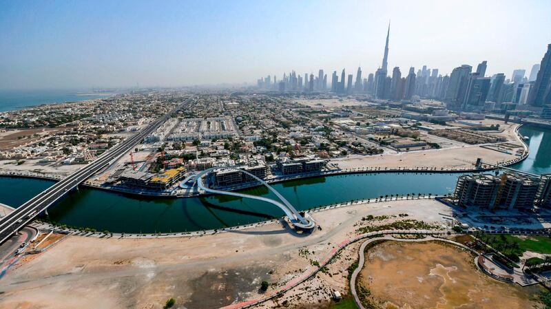 An aerial view of the pedestrian Tolerance Bridge across Dubai Creek. Dubai reopened its doors to international visitors on July 7 after a nearly four-month closure.  AFP