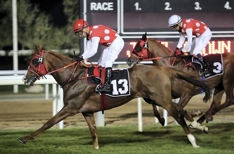 ABU DHABI , UNITED ARAB EMIRATES , October 25 – 2019 :- RB Torch (US) ridden by Tadhg O’Shea  ( no 13  ) won the 4th horse race 1600m at the Abu Dhabi Equestrian Club in Abu Dhabi.  ( Pawan Singh / The National ) For Sports. Story by Amith