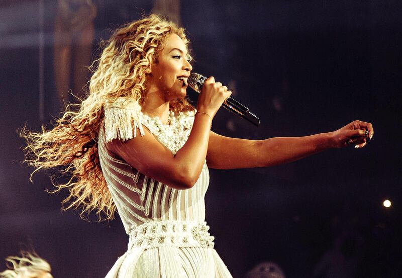 This publicity image released by Parkwood Entertainment shows singer Beyonce performing during her world tour on Saturday, July 13, 2013 at the Bridgestone Arena in Nashville, Tenn. Beyonce called for a moment of silence for Trayvon Martin during a concert just hours after George Zimmerman was found not guilty by a Florida jury on Saturday. After asking the crowd to be silent a moment, she sang the chorus of “I Will Always Love You,” a song written by country music star Dolly Parton and brought to a global audience by the late Whitney Houston. (AP Photo/Parkwood Entertainment, Robin Harper) *** Local Caption ***  People-Beyonce-Trayvon Martin.JPEG-08070.jpg