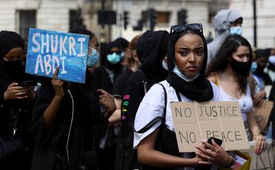 People gather during a demonstration called "Justice for Shukri Abdi" at Whitehall in London, Britain, June 27, 2020. REUTERS/Simon Dawson