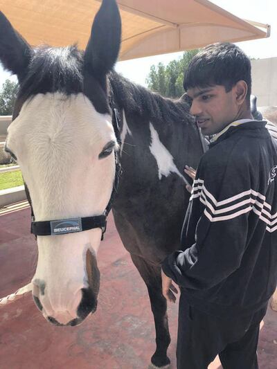 Vikram Kumar, who has autism, has been in equine therapy at Al Marmoom since 2016.