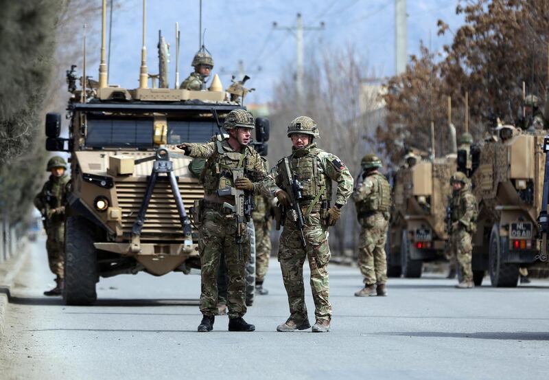 British soldiers with NATO-led Resolute Support Mission forces arrive near the site of an attack in Kabul, Afghanistan. AP Photo