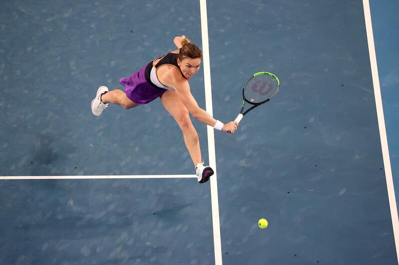 Romania's Simona Halep hits a return against Ajla Tomljanovic of Australia during their women's singles match on the third day of the Australian Open. AFP