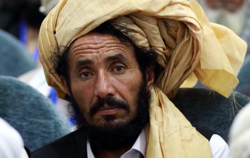 A member of the Afghan loya jirga attends the closing ceremony.  EPA