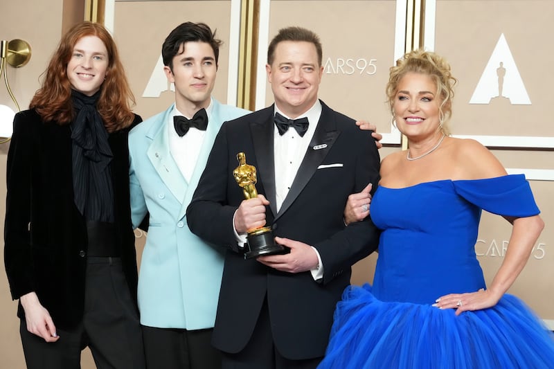 From left, Holden Fletcher Fraser, Leland Francis Fraser, Brendan Fraser and Jeanne Moore. AP