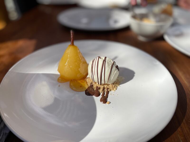 Poached pear with orange marmalade glaze and ice cream. Janice Rodrigues / The National