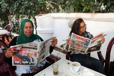 epa07919583 Tunisian women read local newspapers a day after Tunisian presidential election in Tunis, Tunisia, 14 October 2019. According to exit polls, Kais Saied won by 72 percent.  EPA/MOHAMED MESSARA