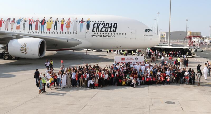 epa08033053 People of various nationalities gather to take flight EK 2019 at Dubai International Airport, United Arab Emirates, 29 November 2019. Some 500 people from 145 nationalities set a new world record for a flight carrying the most different nationalities at the same time. The passengers were invited to board Emirates Airlines flight EK 2019 on the occasion of the 'Year of Tolerance'.  EPA/ALI HAIDER