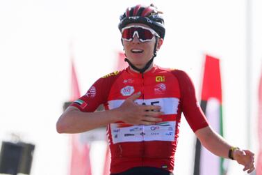 UAE Team Emirates' Slovenian cyclist Tadej Pogacar celebrates as he crosses the finish line to win stage 7 of the United Arab Emirates cycling tour, from Al Jahili Fort to Jebel Hafeet, on February 26, 2022.  (Photo by Giuseppe CACACE  /  AFP)