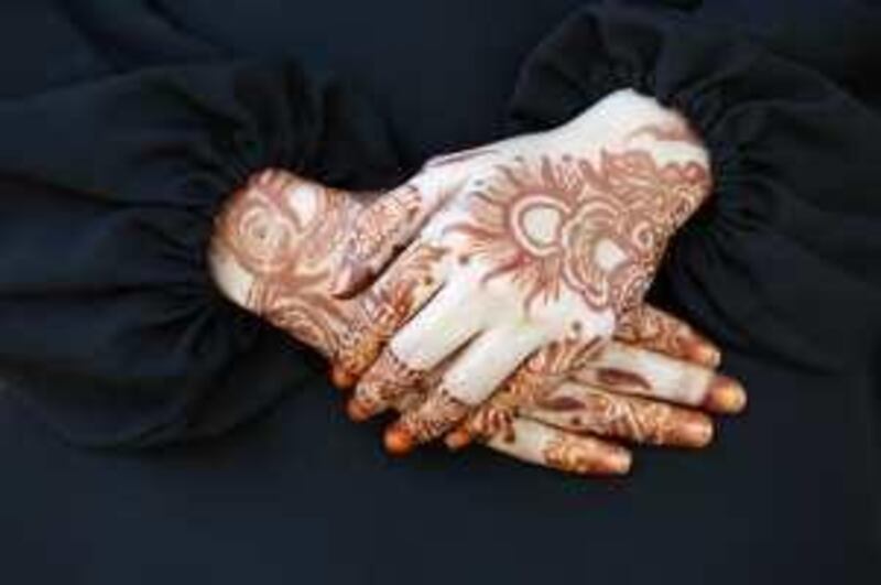 UMM AL QUWAIN, UNITED ARAB EMIRATES - MARCH 09:  A UAE National girl with henna on her hands in Umm Al Quwain on March 09, 2009.  Randi Sokoloff / The National)  For stock/standalone. *** Local Caption ***  RS001-030909-Henna.jpg
