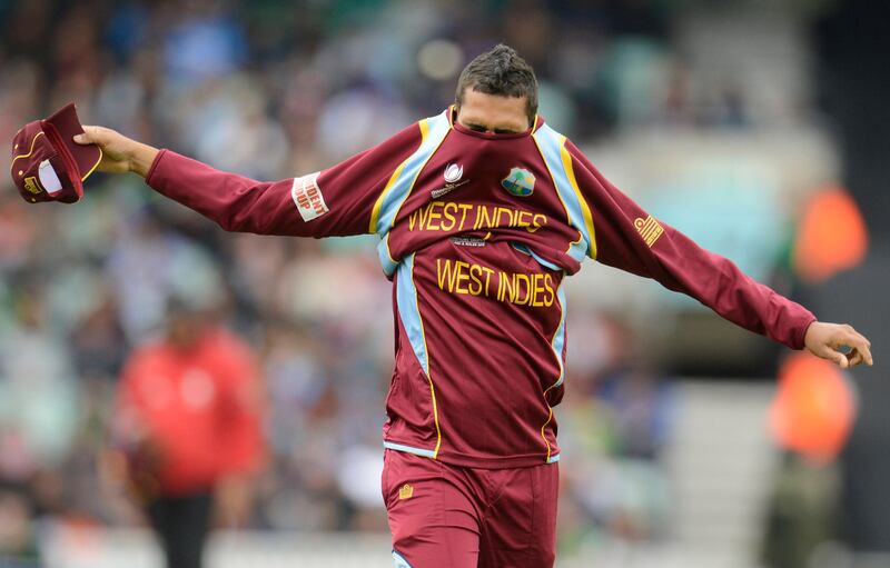 West Indies' Sunil Narine puts on a top during their ICC Champions Trophy Group B match against India at The Oval cricket ground in London June 11, 2013. REUTERS/Philip Brown (BRITAIN - Tags: SPORT CRICKET) *** Local Caption ***  PB19_CRICKET-CHAMPI_0611_11.JPG