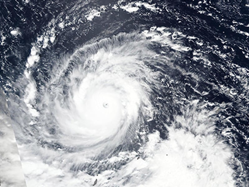 Super Typhoon Mangkhut churns west towards the Philippines. Lauren Dauphin / NASA Earth Observatory via AP