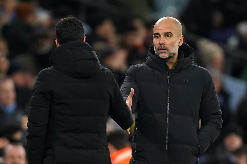 Arsenal manager Mikel Arteta and Manchester City manager Pep Guardiola shake hands after the match. PA