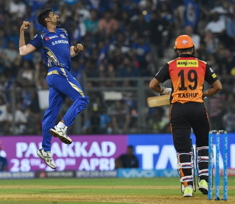 Mumbai Indians cricketer Jasprit Bumrah (L) celebrates after taking the wicket of Sunrisers Hyderabad cricketer Rashid Khan during the 2018 Indian Premier League (IPL) Twenty20 cricket match between Mumbai Indians and Sunrisers Hyderabad at the Wankhede Stadium in Mumbai on April 24, 2018. / AFP PHOTO / INDRANIL MUKHERJEE / ----IMAGE RESTRICTED TO EDITORIAL USE - STRICTLY NO COMMERCIAL USE----- / GETTYOUT