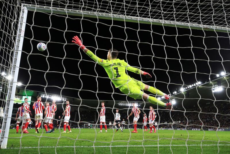 Stoke City goalkeeper Jack Butland cannot stop Wayne Rooney's free-kick finding the net. PA