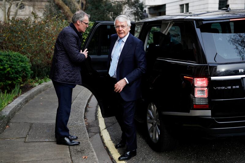 British Prime Minister John Major arrives at the Institute for Government where he will give a speech on trust and standards in democracy, in London, Britain, February 10, 2022. REUTERS/Peter Nicholls