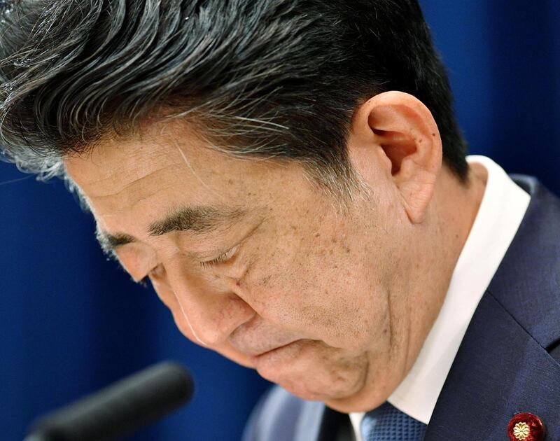 Japan's Prime Minister Shinzo Abe bows his head as he says he is stepping down during a news conference at the prime minister official residence in Tokyo, Japan August 28, 2020, in this photo released by Kyodo. Mandatory credit Kyodo/via REUTERS ATTENTION EDITORS - THIS IMAGE WAS PROVIDED BY A THIRD PARTY. MANDATORY CREDIT. JAPAN OUT. NO COMMERCIAL OR EDITORIAL SALES IN JAPAN.