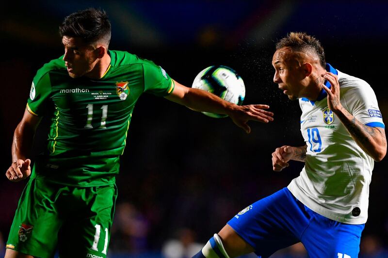 Bolivia's Leonardo Vaca, left, and Brazil's Everton Soares vie for the ball. AFP
