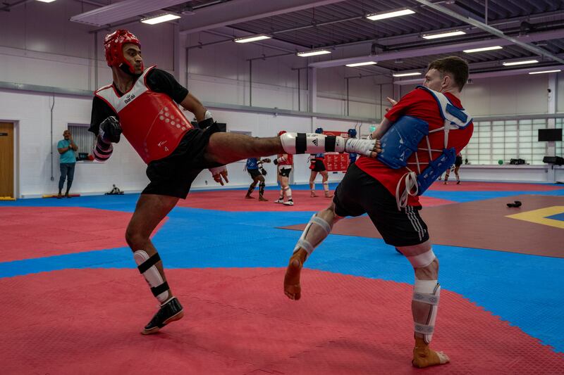 Farzad Mansouri, left, trains with GB World Champion and Tokyo Olympic silver medallist, Bradley Sinden, at the National Taekwondo Centre in Manchester, UK.