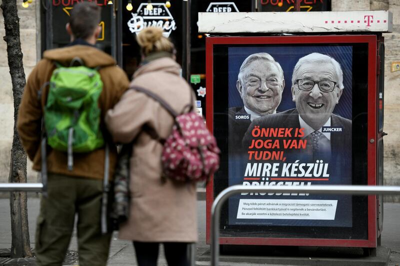 A government poster is seen in Budapest, Hungary, February 21, 2019. The poster reads, "You also have the right to know what Brussels is up to", accusing European Commission President Jean-Claude Juncker of pushing migration plans encouraged by U.S.-Hungarian businessman George Soros, in a media campaign rebuked by the commission. REUTERS/Tamas Kaszas