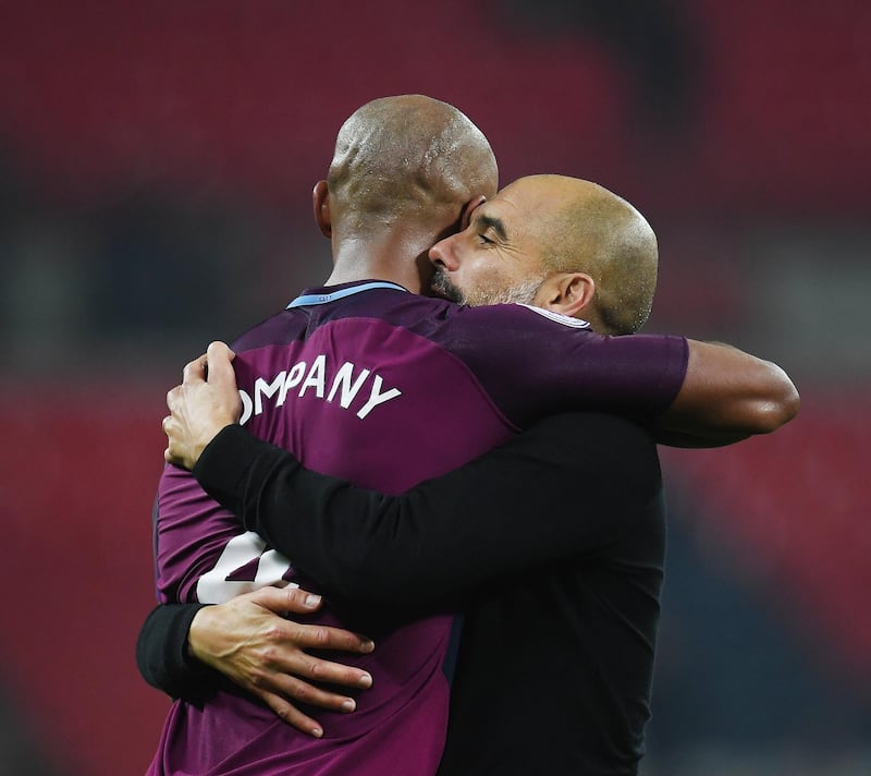 epa06669957 Manchester City manager Pep Guardiola celebrates with captain Vincent Kompany after winning the English Premier League soccer match Tottenham Hotspur vs Manchester City  at Wembley Stadium, London, Britain, 14 April 2018.  EPA/ANDY RAIN EDITORIAL USE ONLY. No use with unauthorized audio, video, data, fixture lists, club/league logos or 'live' services. Online in-match use limited to 75 images, no video emulation. No use in betting, games or single club/league/player publications