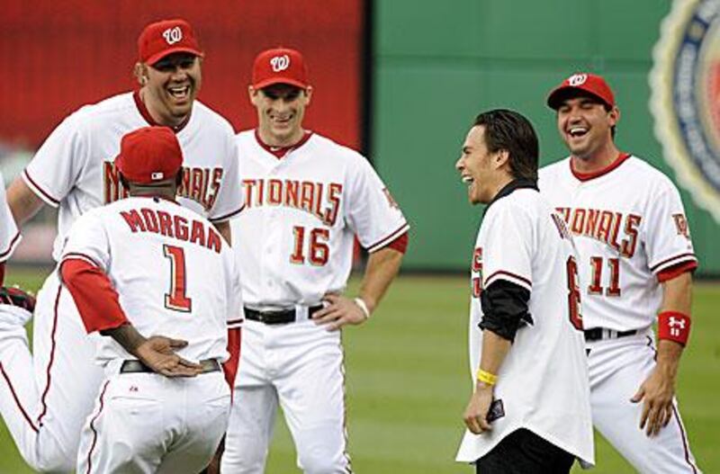 Apolo Anton Ohno, second from right, talks to Nyjer Morgan (1), Adam Dunn (44), Josh Willingham (16) and Ryan Zimmerman (11) and let their chemistry felt.