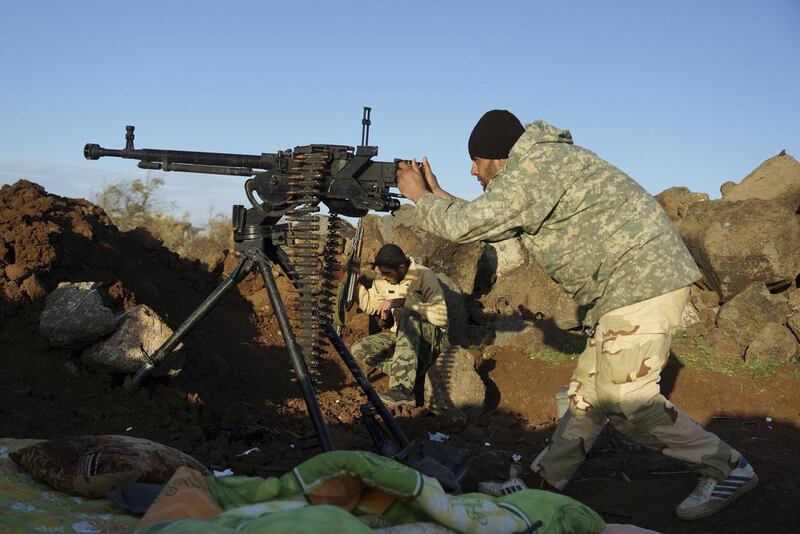 Free Syrian Army fighterstake aim at the frontline in Deraa. A series of conflicts are under way in the south, involving Jabhat Al Nusra, the Jihad Army, the Brigades, the FSA and pro-government forces. Reuters